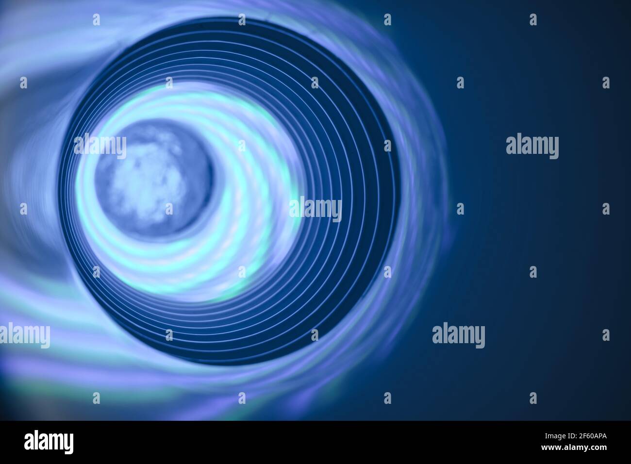 Abstract swirl tunnel with silver blue light on a background pattern ...