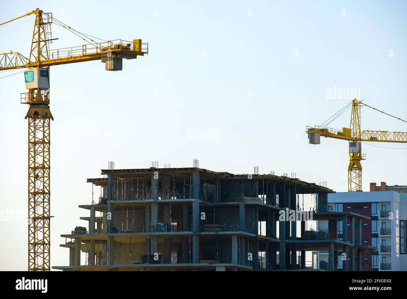 Aerial view of tower cranes and high residential apartment buildings ...