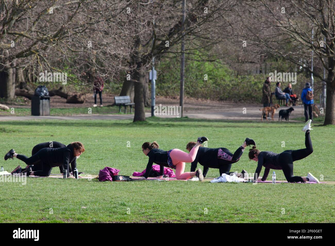 London, UK, 29 March 2021: On Tooting Commons a group of women take an outdoor exercise class, which from today is permitted under the gradual easing of lockdown rules in England. Anna Watson/Alamy Live News Stock Photo