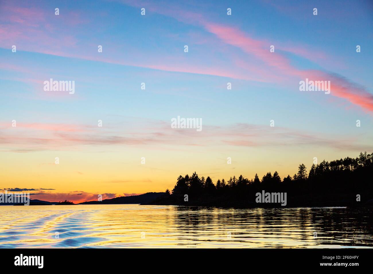 Sunset over the copeland Islands from a boat from Lund on the strait of Georgia Stock Photo