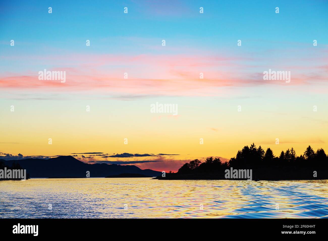Sunset over the copeland Islands from a boat from Lund on the strait of Georgia Stock Photo
