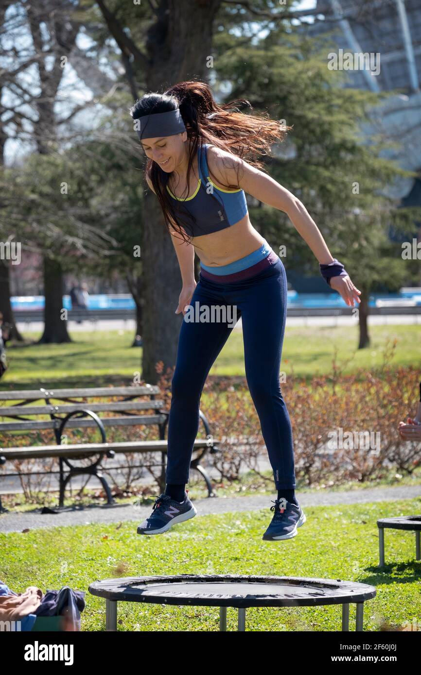 An attractive fit woman at an urban rebounding class in Queens, New York City. Stock Photo