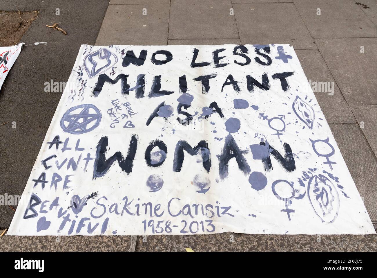 London, United Kingdom. 29th Mar, 2021. A supporters banner on the footpath. The police station had been occupied by squatters and autonomous activists under the name of ‘Not A Cop Shop’ for over a week, in opposition to the new ‘Police, Crime, Sentencing, and Courts Bill’ and femicide. Cavendish Road Police Station, Clapham, London, United Kingdom. Credit: Joshua Windsor/Alamy Live News. Stock Photo