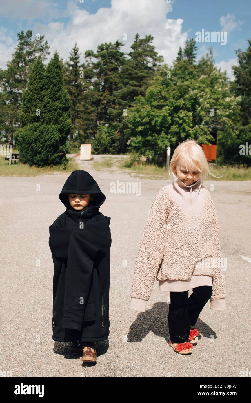 Two girls walking in park hi-res stock photography and images - Alamy
