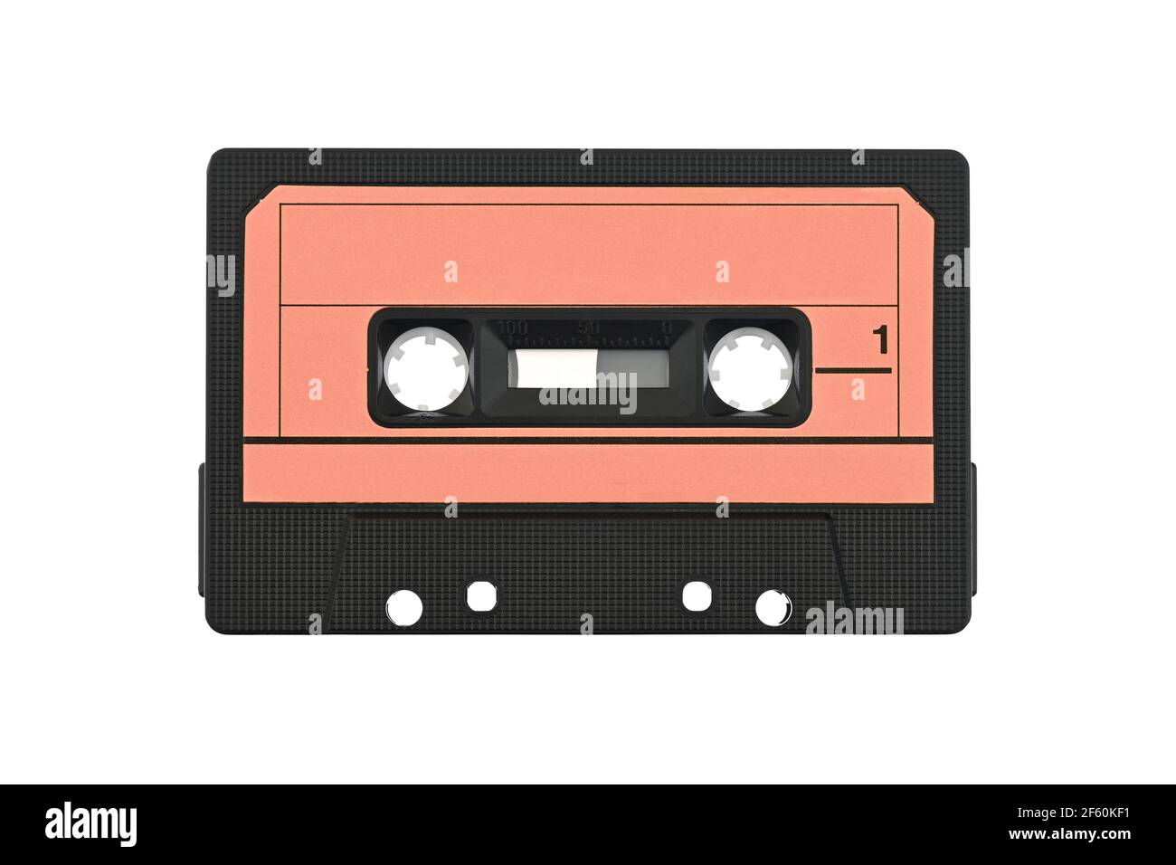 Cassette tape isolated on white. Vintage audio cassette, retro red coloring. Stock Photo