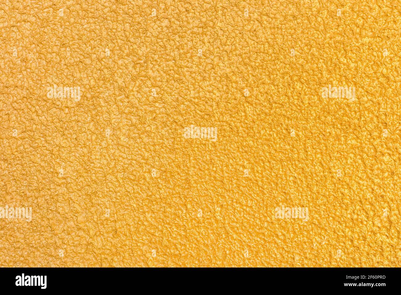 Abstract gold stucco wall texture, plaster yellow pattern background. Stock Photo