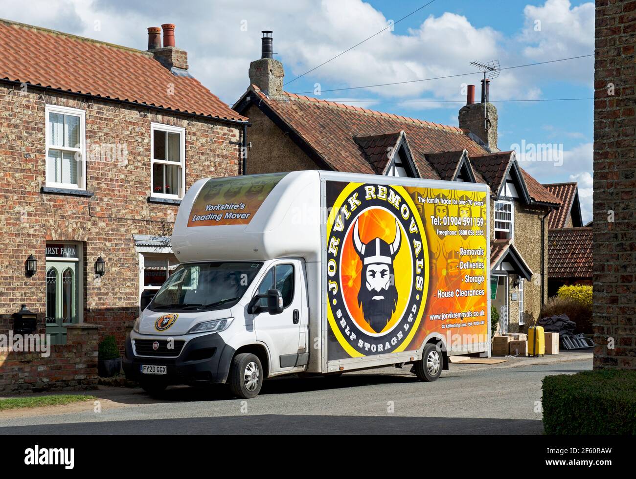 Removals van parked in the village of Askham Richard, North Yorkshire, England UK Stock Photo