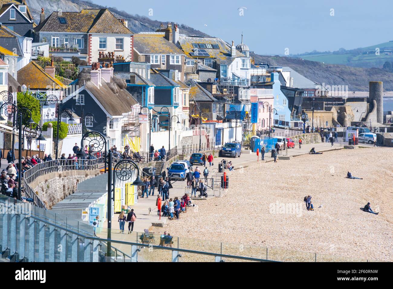 Lyme Regis, Dorset, UK. 29th Mar, 2021. UK Weather: The seaside resort of Lyme Regis basks in glorious warm spring sunshine as the coronavirus lockdown restrictions ease toay. Temperatures are set to soar with the south coast seeing sizzling conditions this week. Credit: Celia McMahon/Alamy Live News Stock Photo