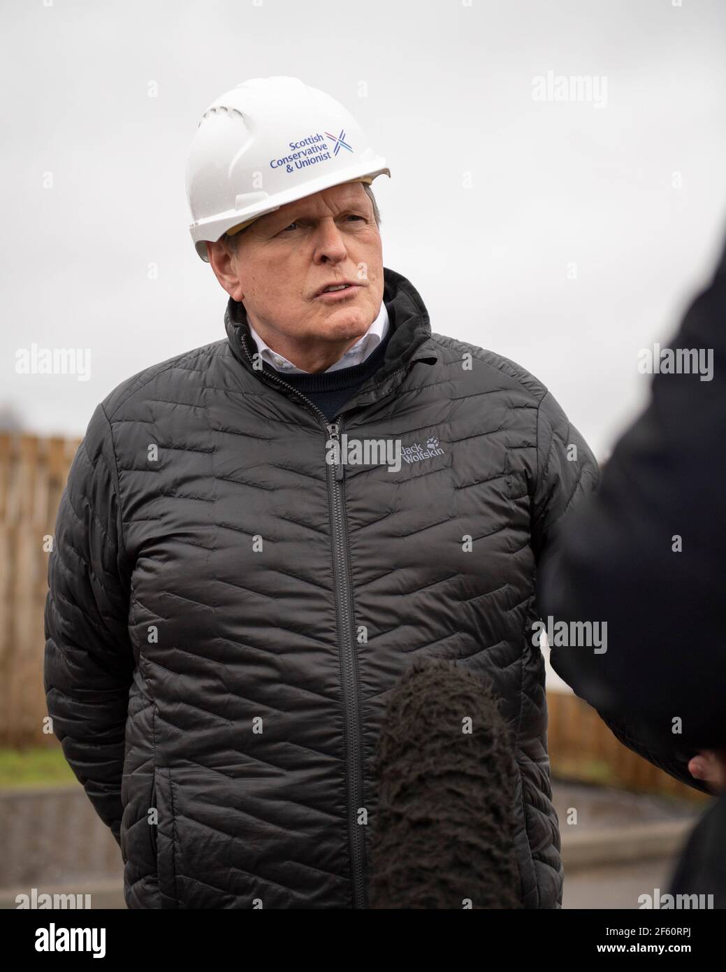 Coatbridge, Scotland, UK. 29th Mar, 2021. PICTURED: Stephen Kerr, Scottish Conservative lead candidate for Central region. The Scottish Conservatives have announced a manifesto pledge for the biggest social housebuilding drive since devolution began. The ambitious targets would see 40,000 homes for social rent built over the next Parliament, around 8,000 per year. The party would also aim to restore the housebuilding sector to pre-SNP and pre-financial crash levels by seeking to build 25,000 homes in total per year by the end of the next parliamentary term. Credit: Colin Fisher/Alamy Live News Stock Photo