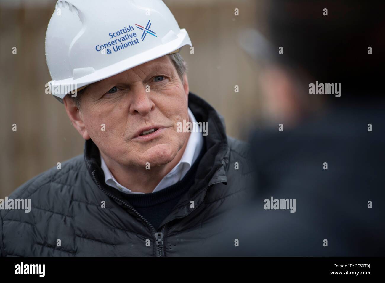 Coatbridge, Scotland, UK. 29th Mar, 2021. PICTURED: Stephen Kerr, Scottish Conservative lead candidate for Central region. The Scottish Conservatives have announced a manifesto pledge for the biggest social housebuilding drive since devolution began. The ambitious targets would see 40,000 homes for social rent built over the next Parliament, around 8,000 per year. The party would also aim to restore the housebuilding sector to pre-SNP and pre-financial crash levels by seeking to build 25,000 homes in total per year by the end of the next parliamentary term. Credit: Colin Fisher/Alamy Live News Stock Photo