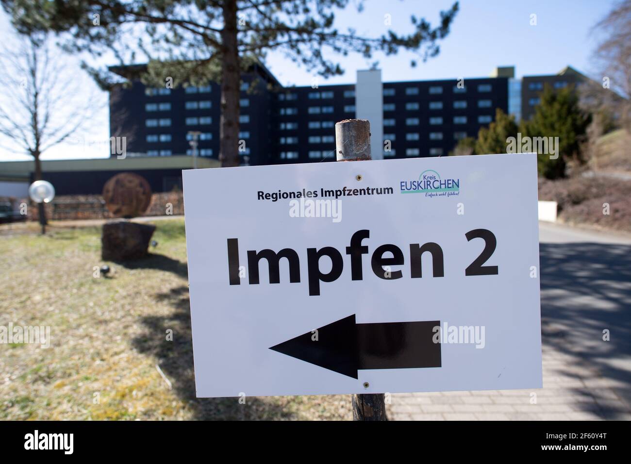 Marmagen, Germany. 29th Mar, 2021. A sign points to the Regional Vaccination Centre of the Euskirchen district. Following the death of a 47-year-old woman, the district of Euskirchen reported the case to the Paul Ehrlich Institute in order to have a possible connection with the woman's Corona vaccination investigated. The woman had been vaccinated with the active substance by Astrazeneca. Credit: Federico Gambarini/dpa/Alamy Live News Stock Photo