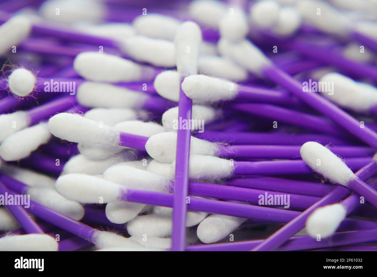 Cleaning hygienic cotton swabs in a pile. Plastic sticks with a cotton