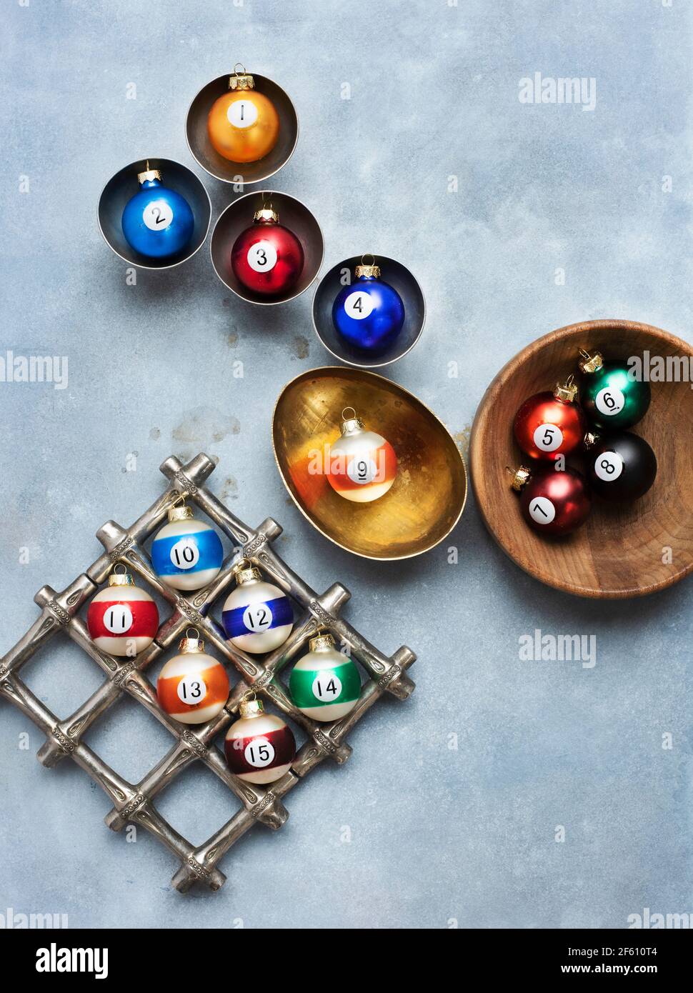 Christmas ornaments in gold, wood and silver bowls Stock Photo