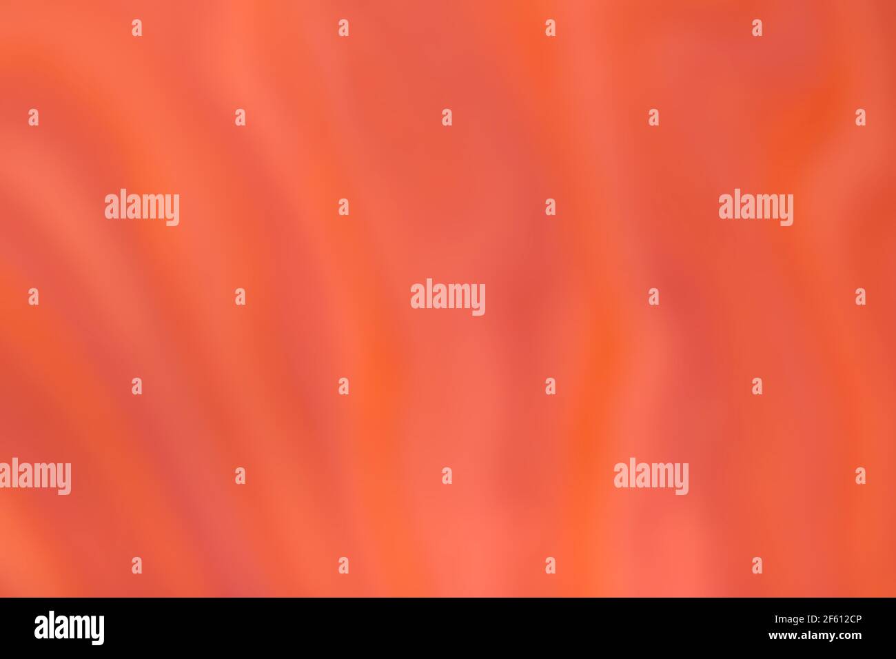 Blurred bright orange and red background with wavy curly pattern ...