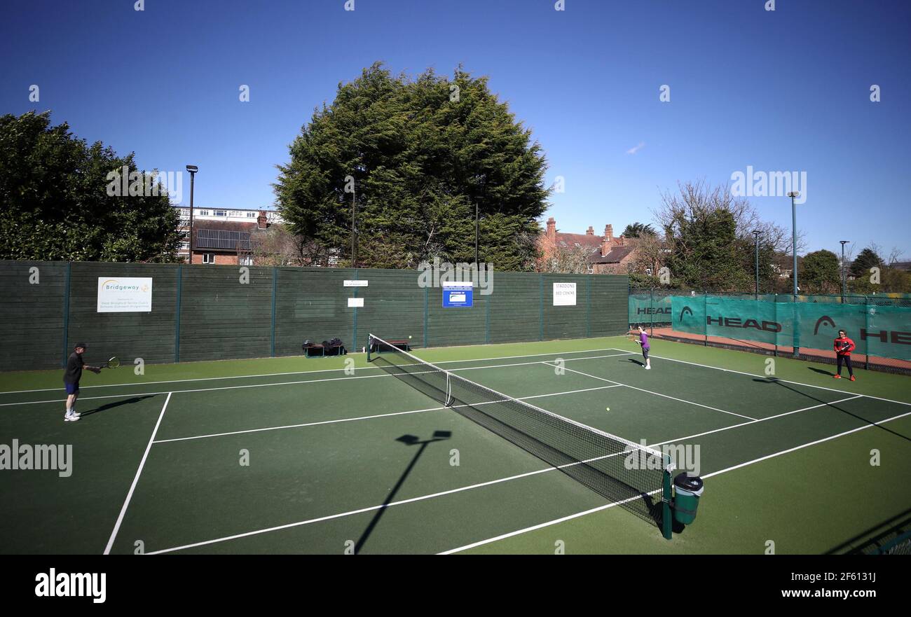 Members play tennis after the re-opening at West Bridgford Tennis Club,  Nottingham, following the easing of England's lockdown to allow far greater  freedom outdoors. Picture date: Monday March 29, 2021 Stock Photo -