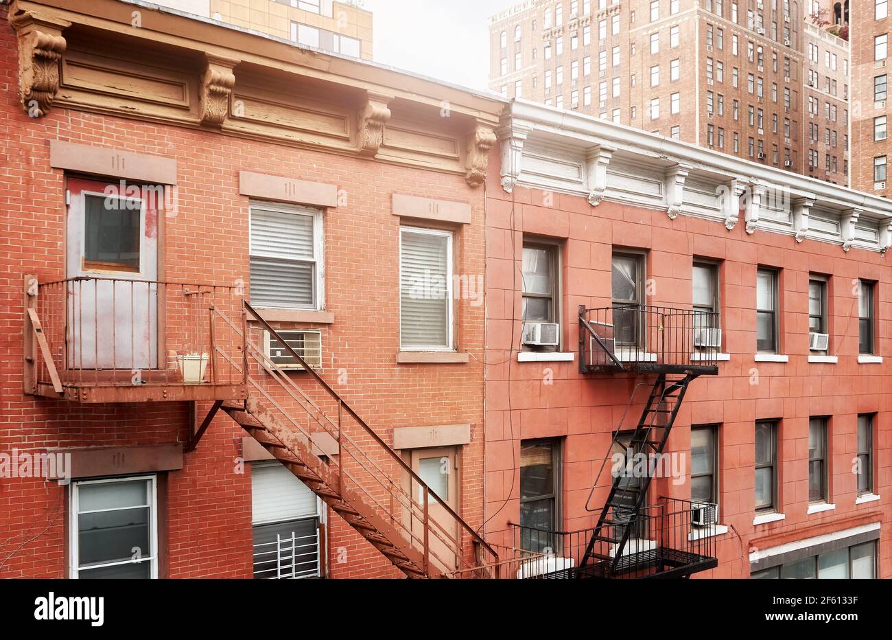 Old residential buildings with iron fire escapes, New York City, USA ...