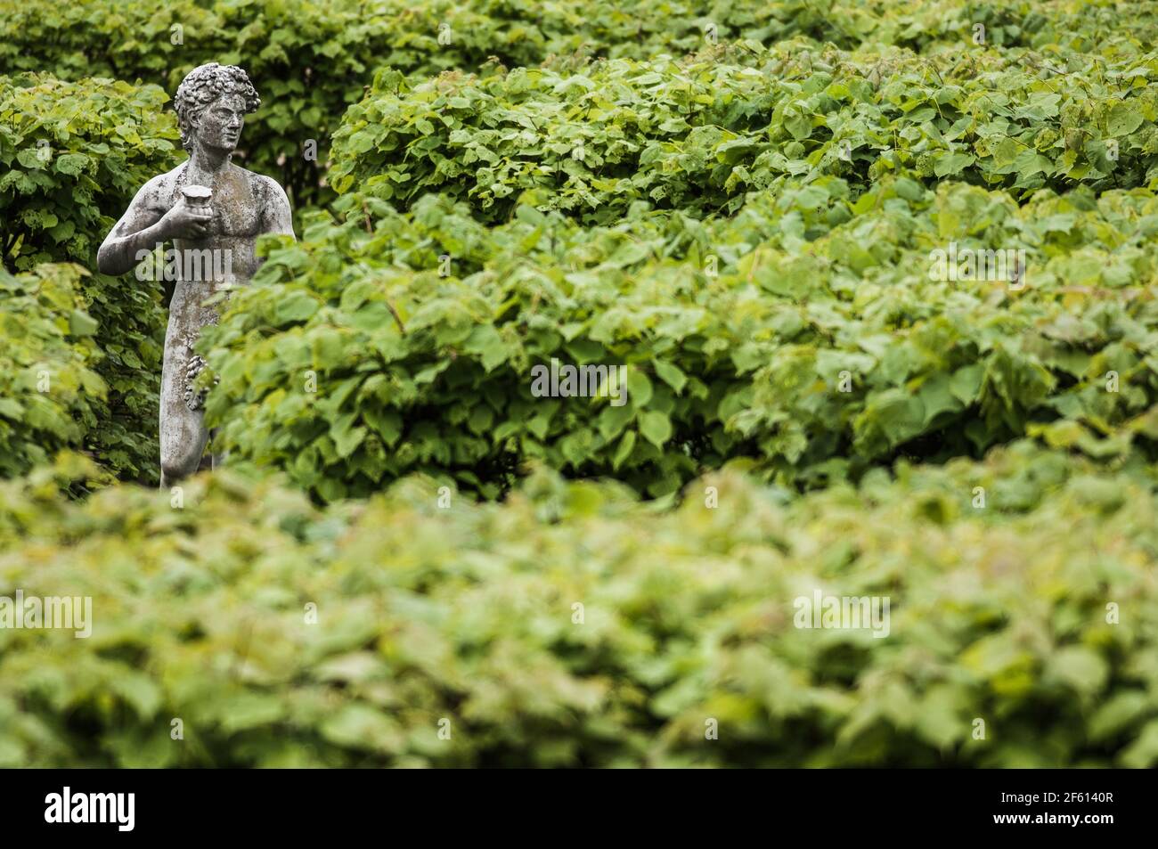 Statue in garden Stock Photo Alamy