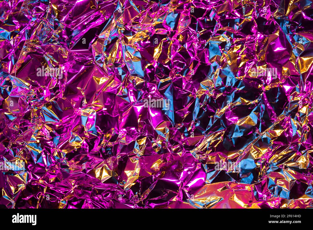 Fashion metal chrome of crumled silver foil with mix of blues and gold colors. Modern background with iridescent effect. Shine metallic Stock Photo - Alamy