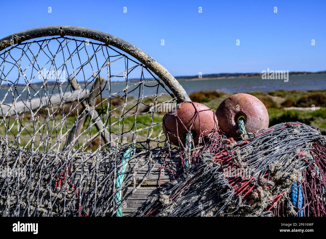 Eel fishing gear and nets drying in the sun at Bages, Parc naturel régional de la Narbonnaise en Méditerranée, Aude, France Stock Photo