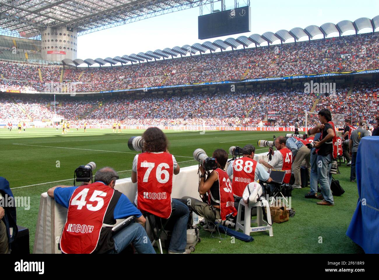 Photographers at work at the San Siro football stadium, in Milan, Italy. Stock Photo