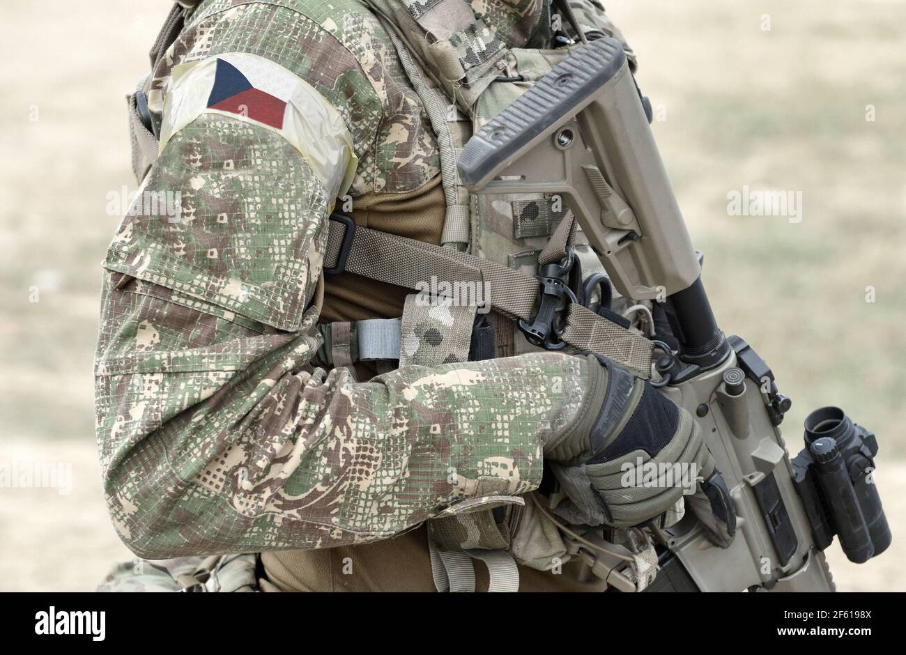 Soldier with assault rifle and flag of Czech Republic on military uniform. Collage. Stock Photo