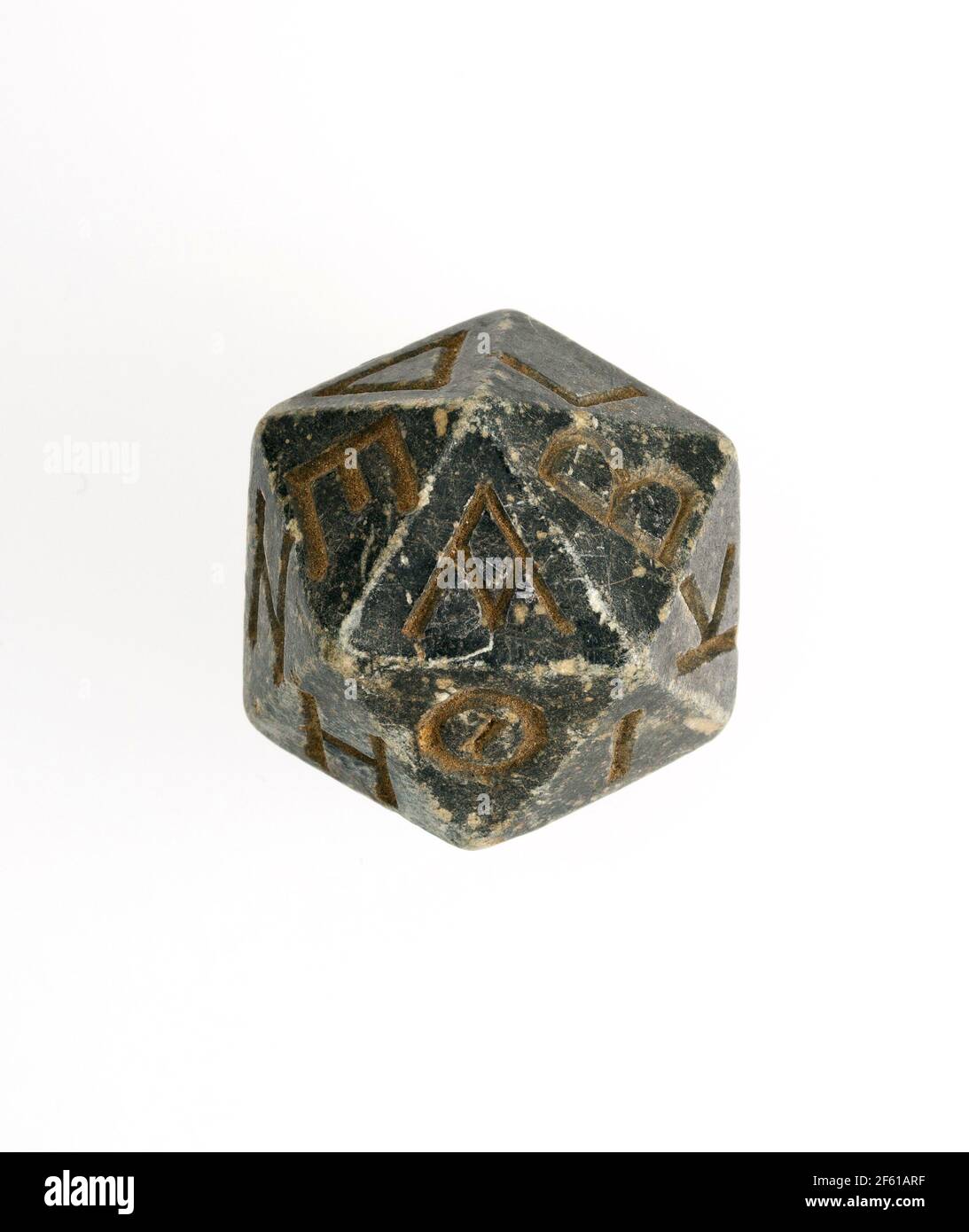 Twenty-sided Die (Icosahedron) with Greek Letters, Egyptian Stock Photo