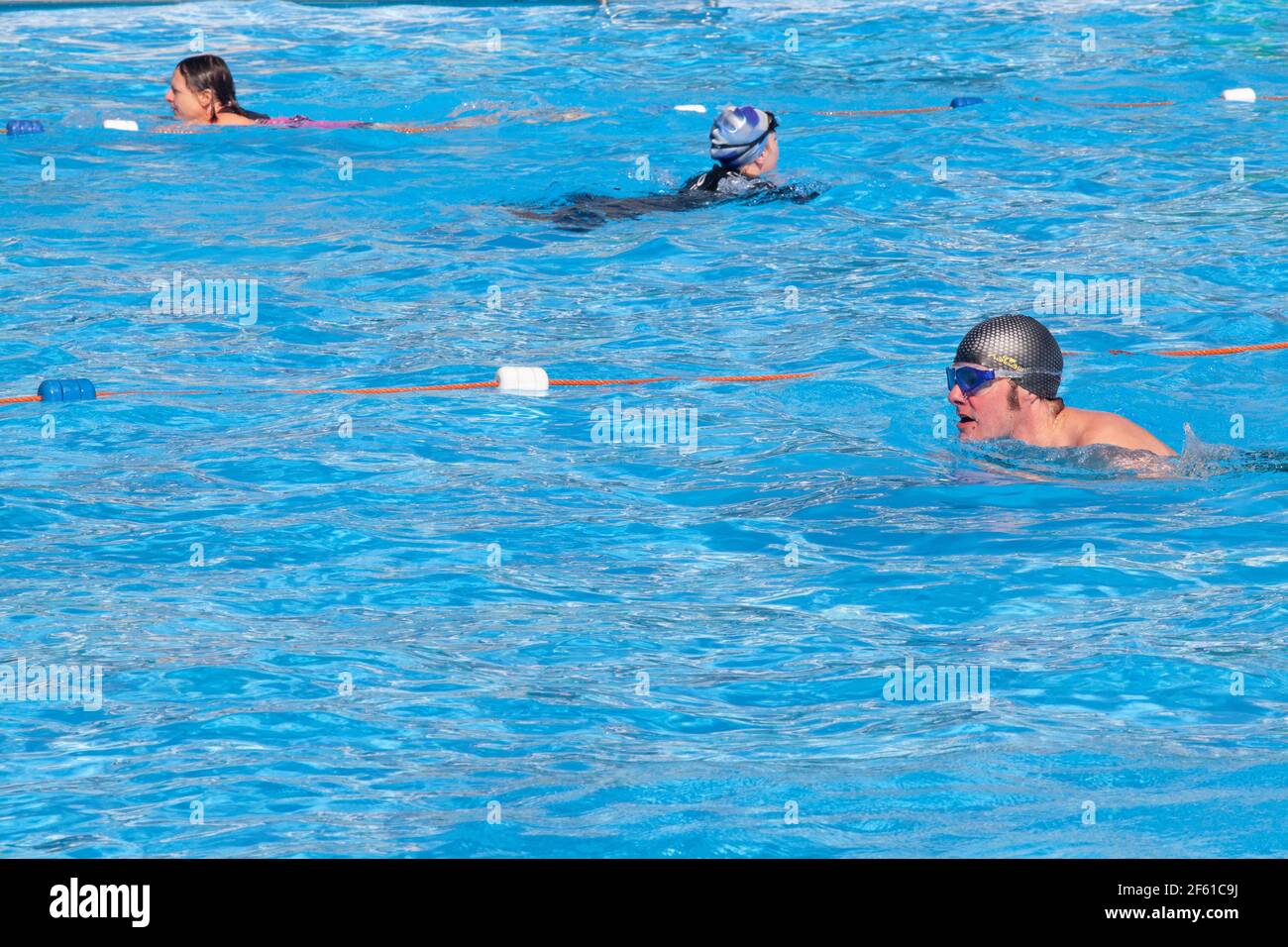 London, UK, 29 March 2021: Brockwell Lido reopened today as lockdown eases  in England. Swimmers of all ages took advantage of the sunshine to brave  water at a chilly 9.8 centigrade. The