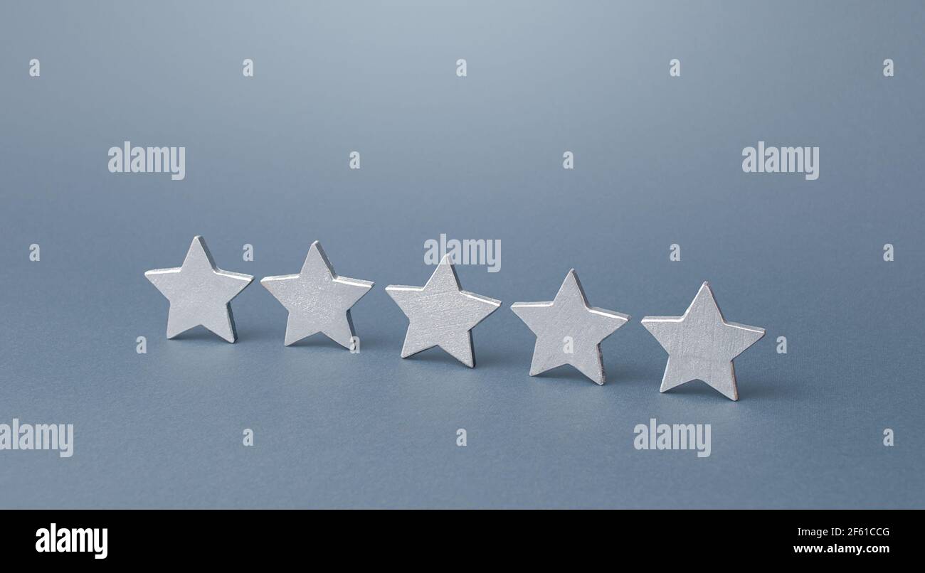 Five gray stars. Rating evaluation concept. Service quality. Buyer feedback. Popularity rating of a restaurant, hotel or mobile software applications Stock Photo