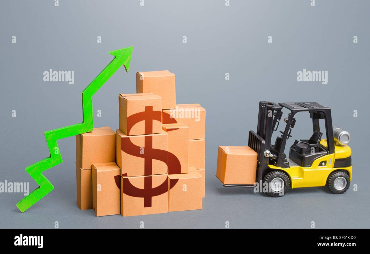 Forklift near a stack of dollar boxes with a green up arrow. Sales growth concept. Production and freight of goods. Increase in imports and exports, e Stock Photo