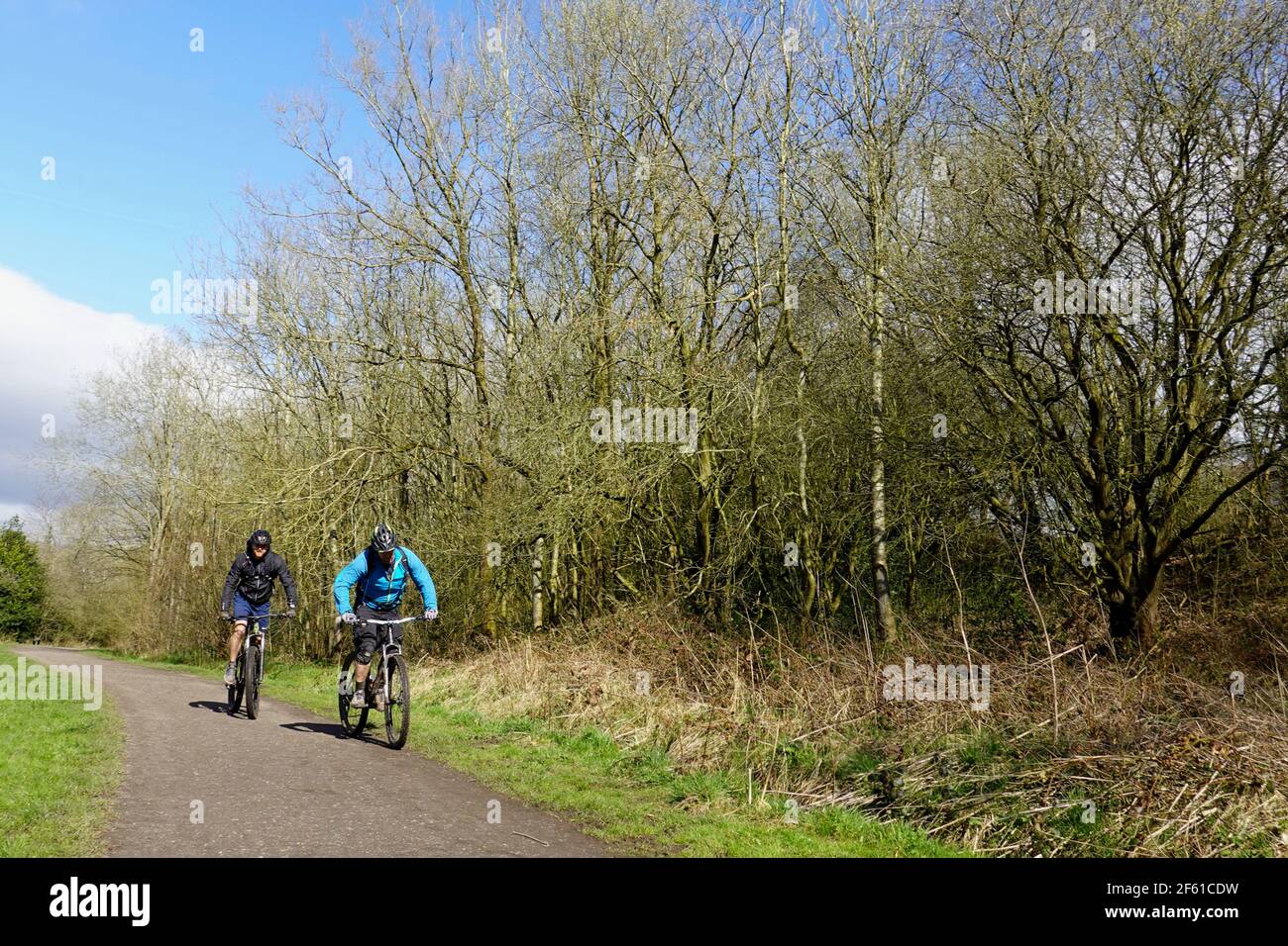 Two cyclists on the Sett Valley Trail in New Mills, Derbyshire. Stock Photo