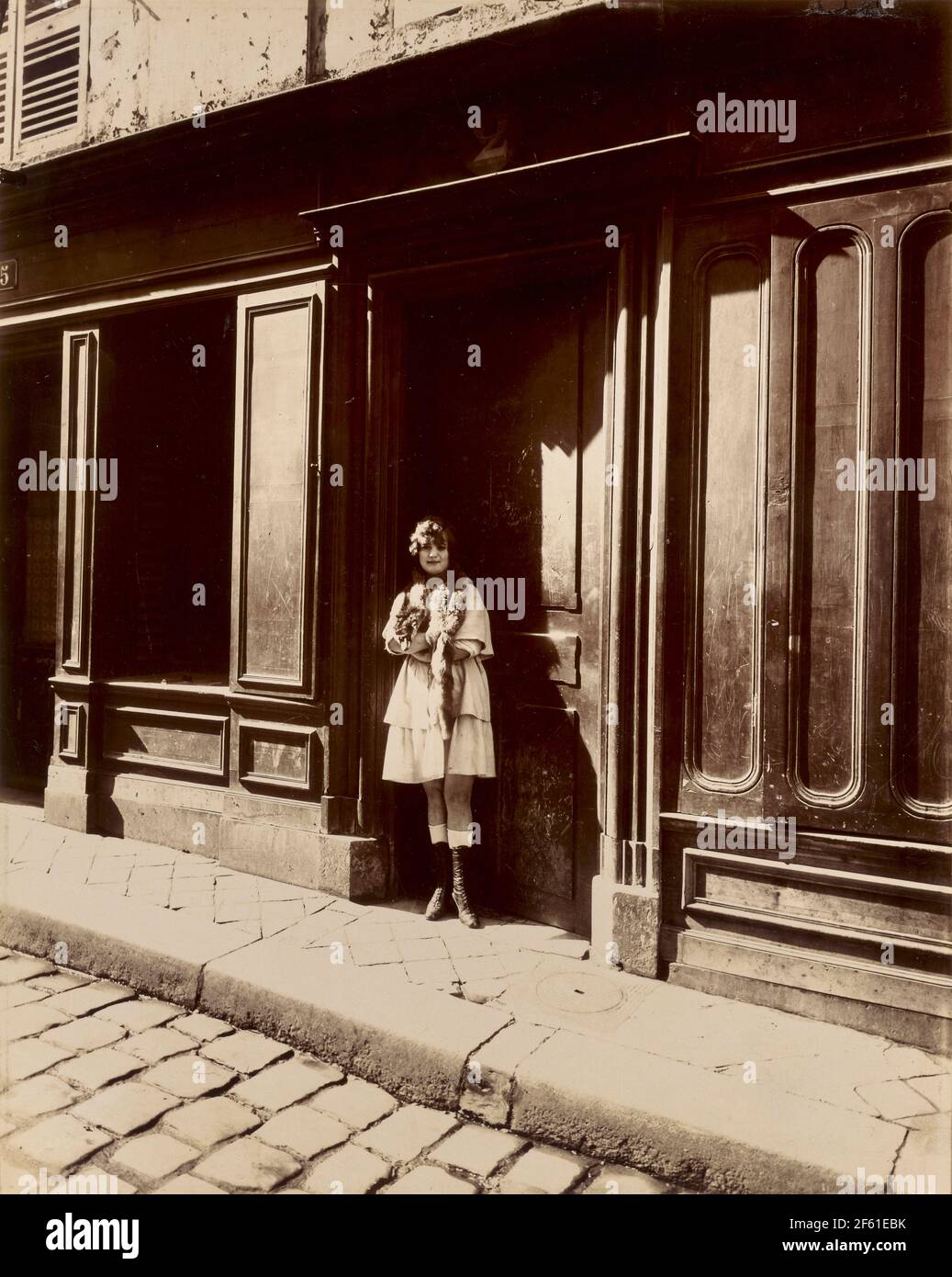Facade of brothel, Petit Place, Versailles, France circa 1921 by Eugene Atget.  Eugène Atget, full name Jean-Eugène-Auguste Atget, 1857 - 1927.  French photographer, famed for his decades long work to document the architecture and aura of Paris before all was lost to modernisation. Stock Photo