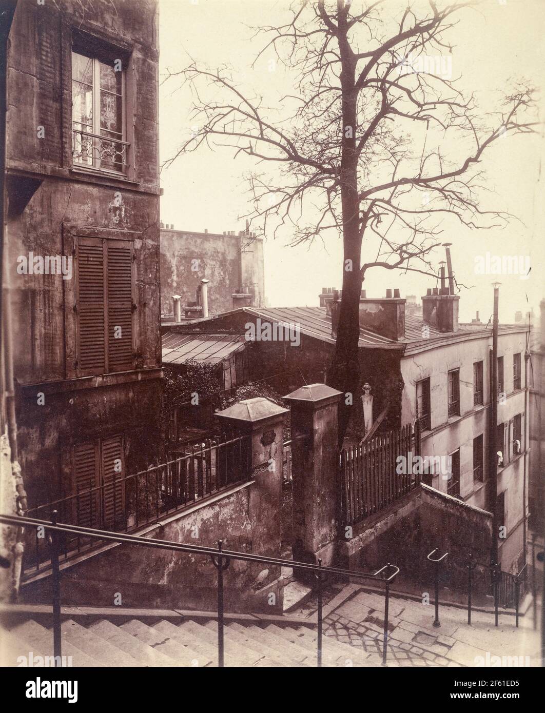 Staircase, Montmartre, Paris, France circa 1921 by Eugene Atget.  Eugène Atget, full name Jean-Eugène-Auguste Atget, 1857 - 1927.  French photographer, famed for his decades long work to document the architecture and aura of Paris before all was lost to modernisation. Stock Photo