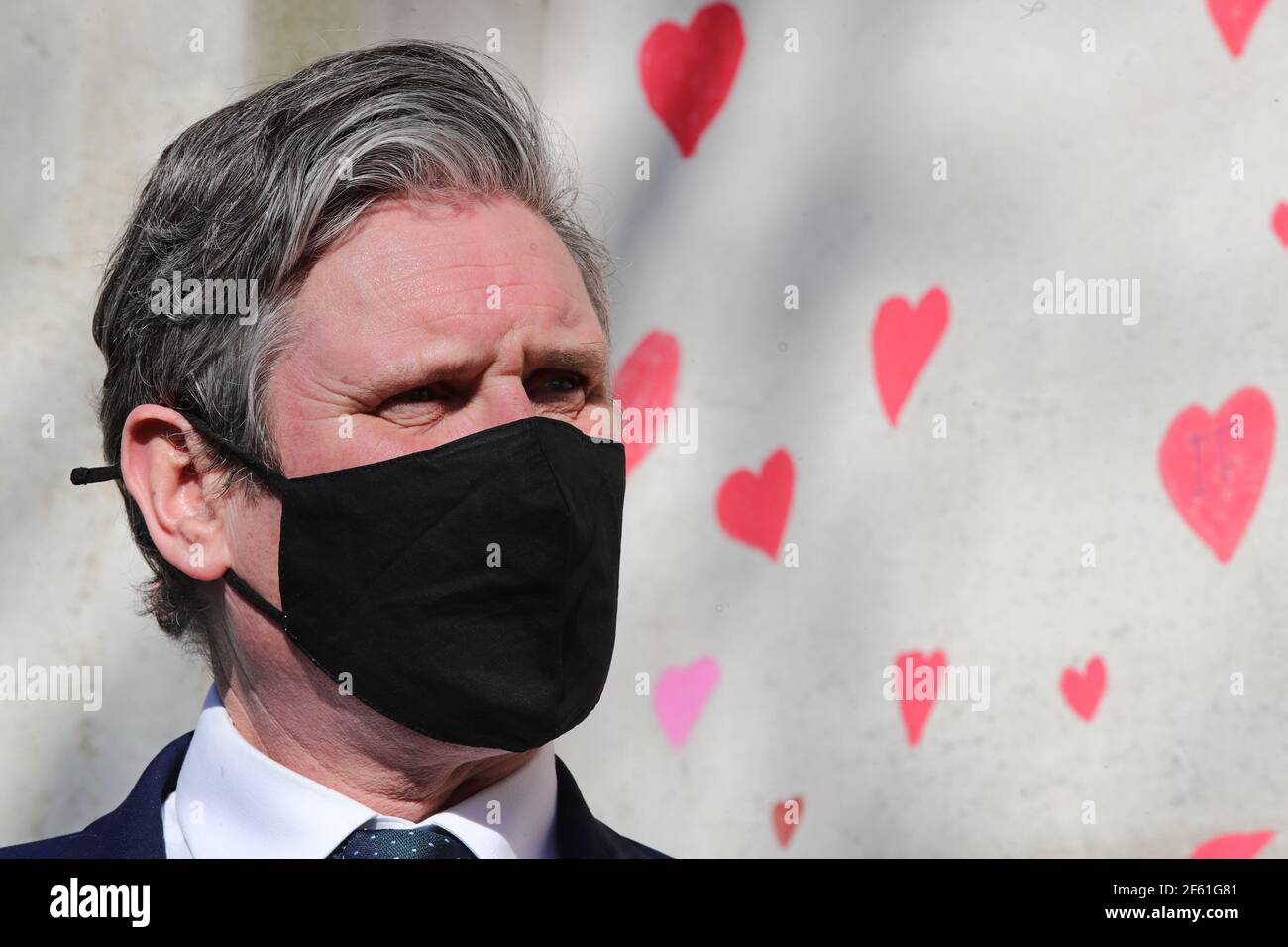 Labour Party leader Keir Starmer visits the COVID-19 Memorial Wall on the Embankment, central London, which has been painted with hearts in memory of the more than 145,000 people who have died in the UK from coronavirus. Picture date: Monday March 29, 2021. Stock Photo