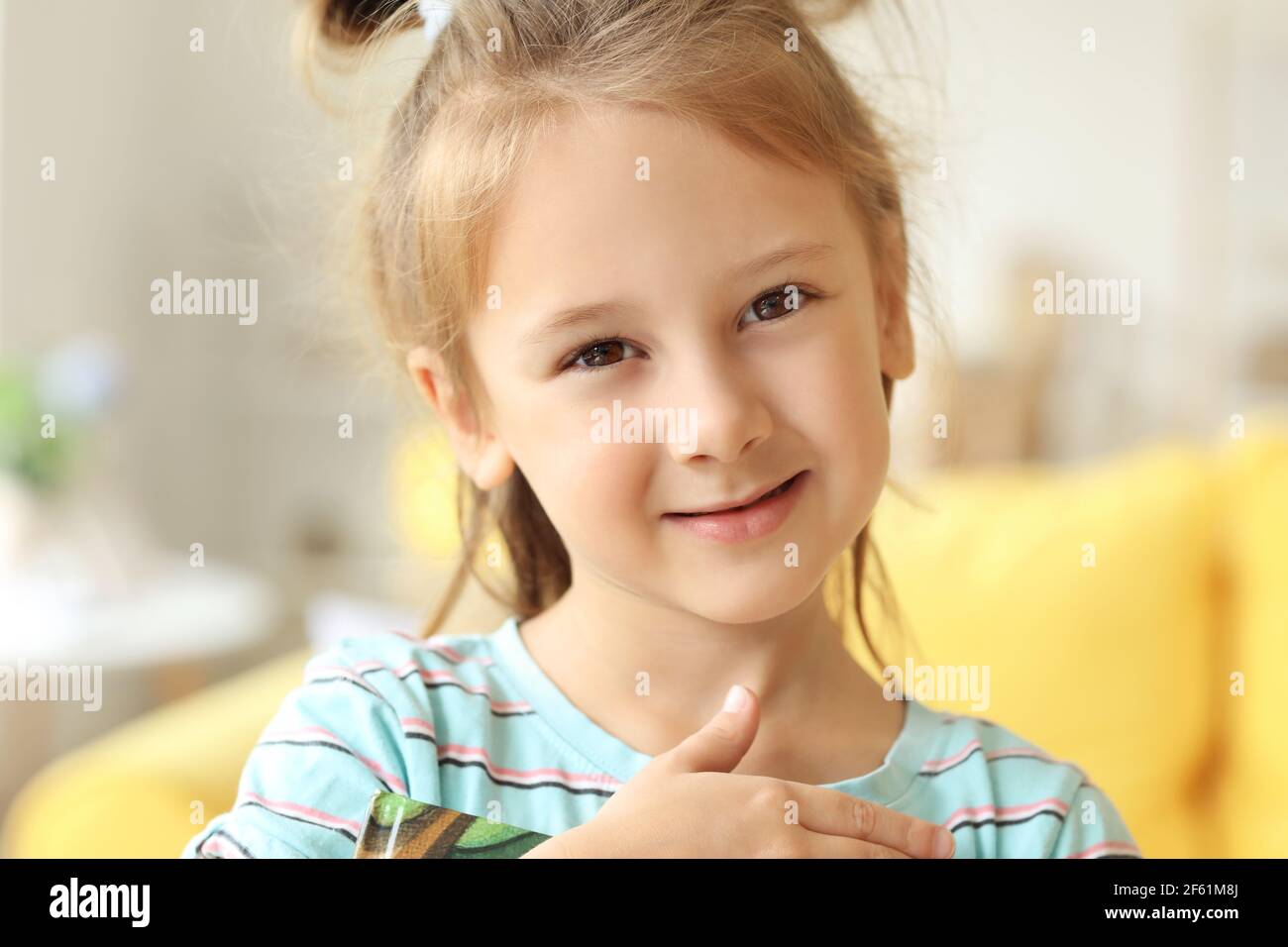 Cute little girl at home Stock Photo - Alamy