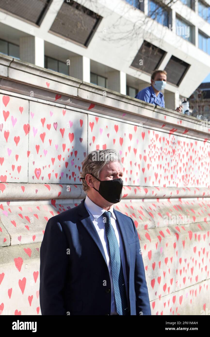 Labour Party leader Keir Starmer visits the COVID-19 Memorial Wall on the Embankment, central London, which has been painted with hearts in memory of the more than 145,000 people who have died in the UK from coronavirus. Picture date: Monday March 29, 2021. Stock Photo