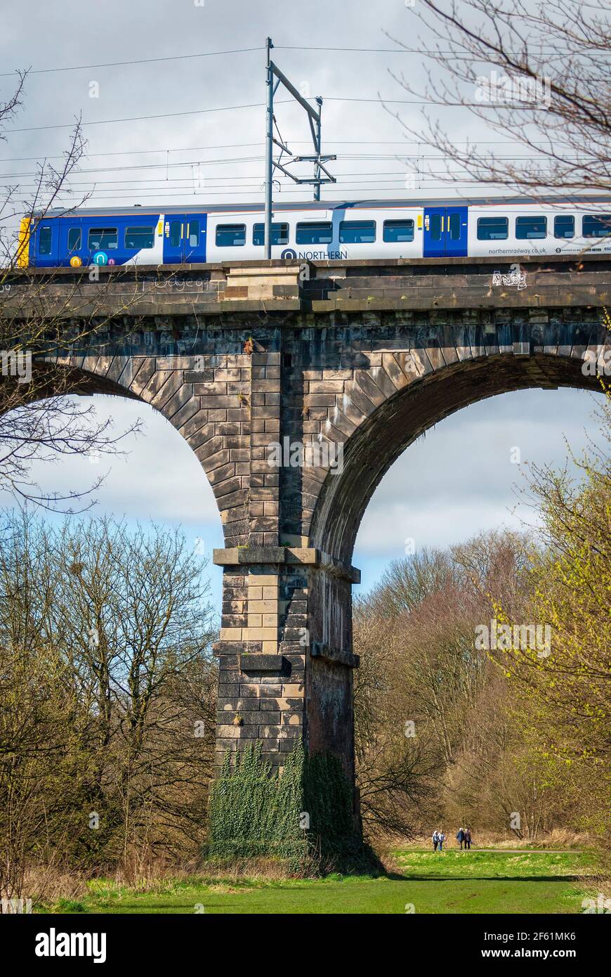 A Northern Rail train crossing the Sankey viaduct at Earlestown over the Sankey Valley. Stock Photo