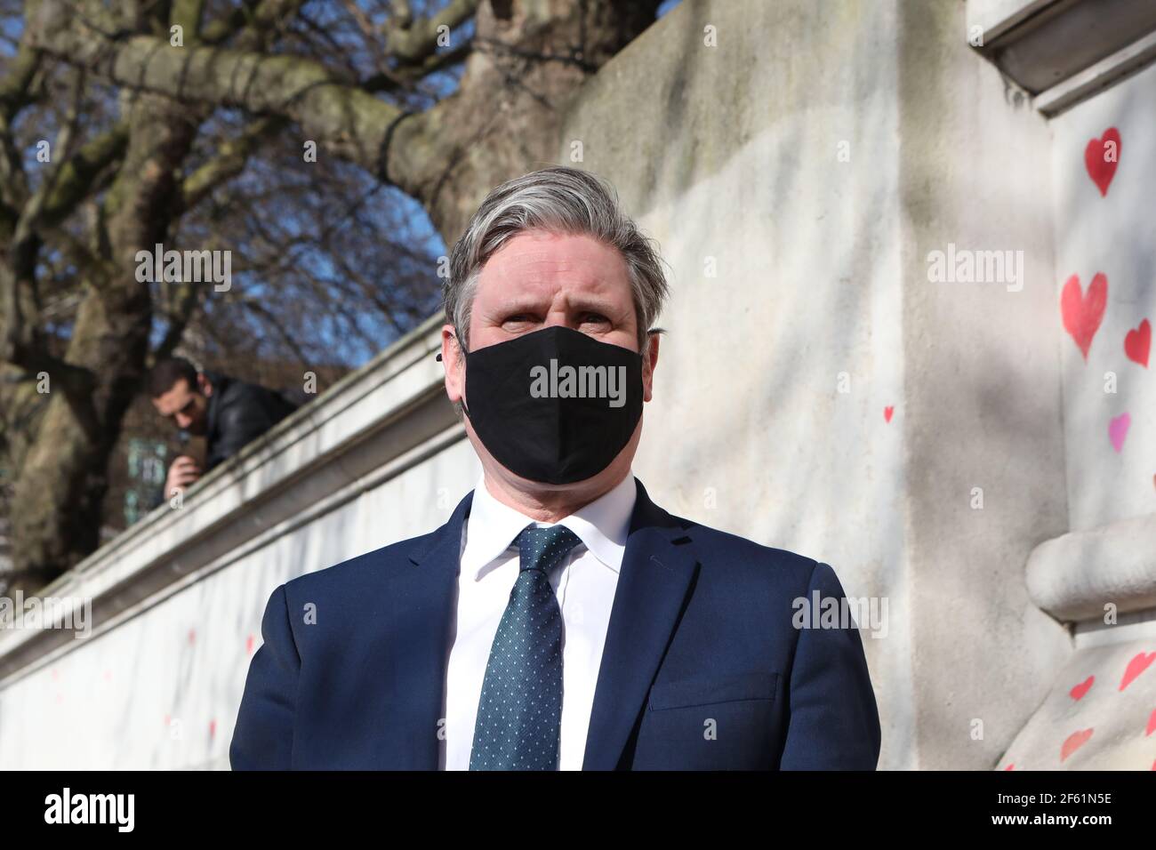 Labour Party leader Keir Starmer visits the COVID-19 Memorial Wall on the Embankment, central London, which has been painted with hearts in memory of the more than 145,000 people who have died in the UK from coronavirus. Picture date: Monday March 29, 2021. Stock Photo