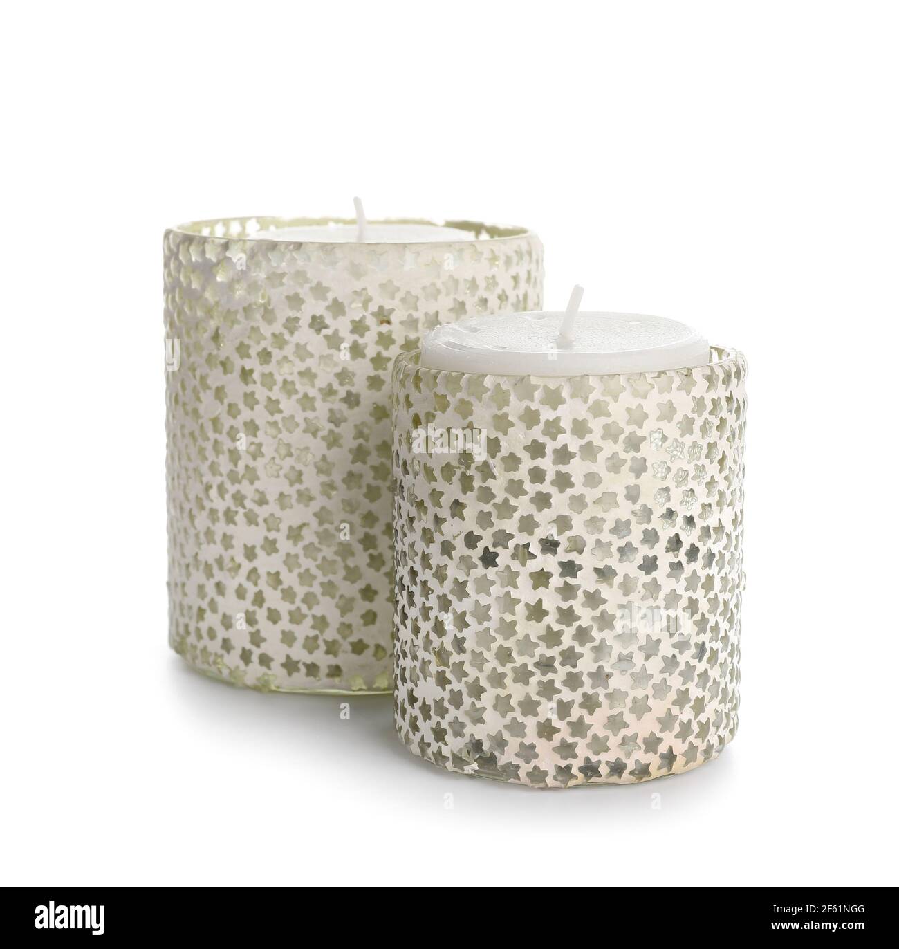 Candles in holders on white background Stock Photo - Alamy