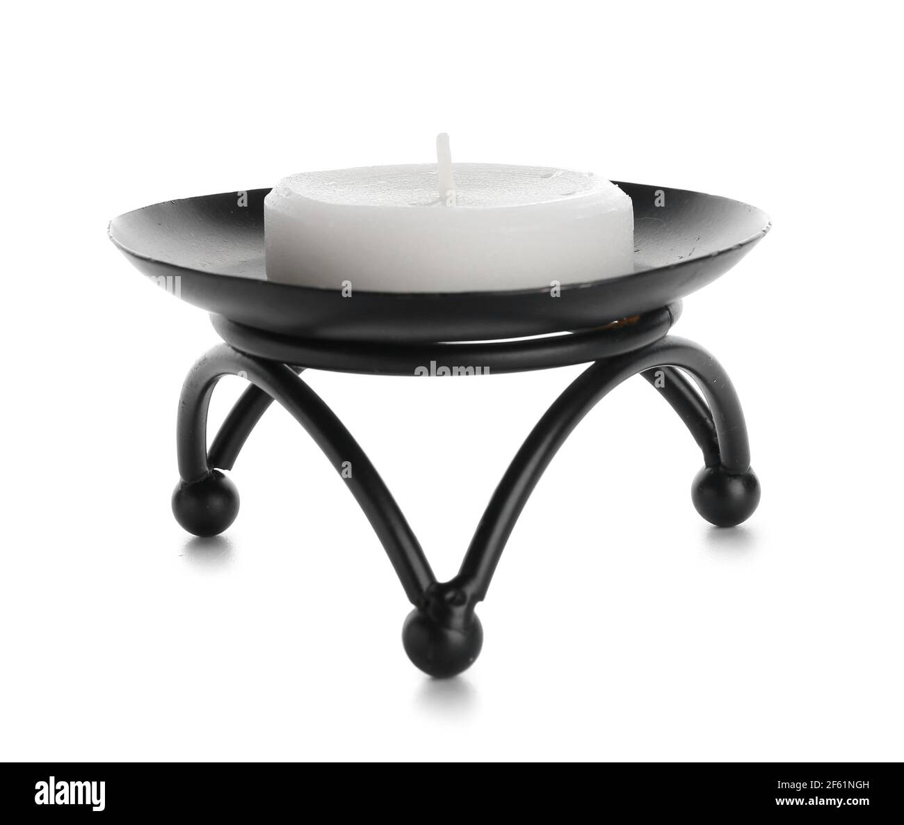 Candle in stylish holder on white background Stock Photo - Alamy