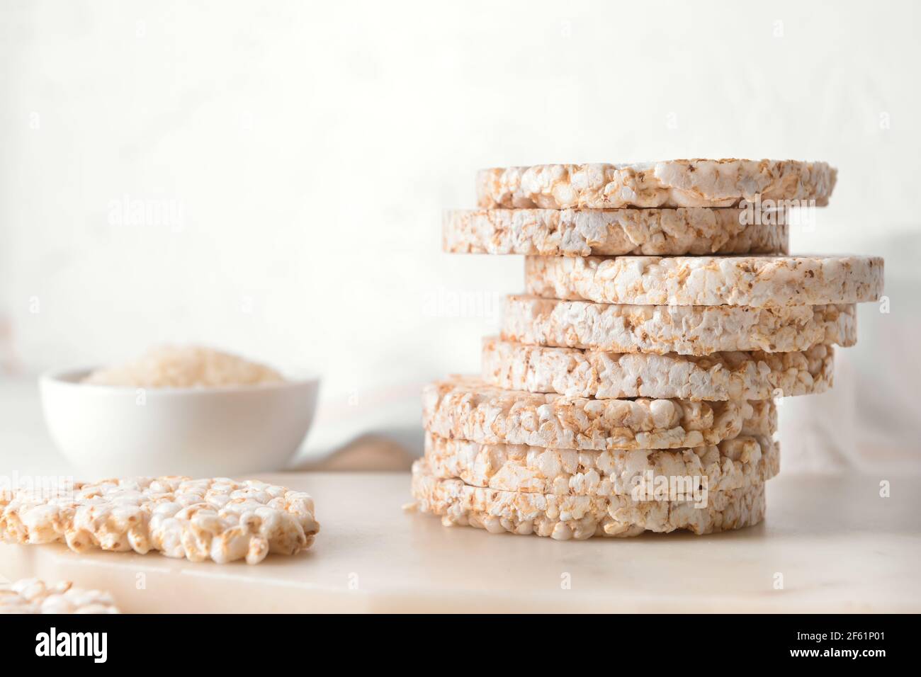 Stack of rice crackers on light background Stock Photo - Alamy