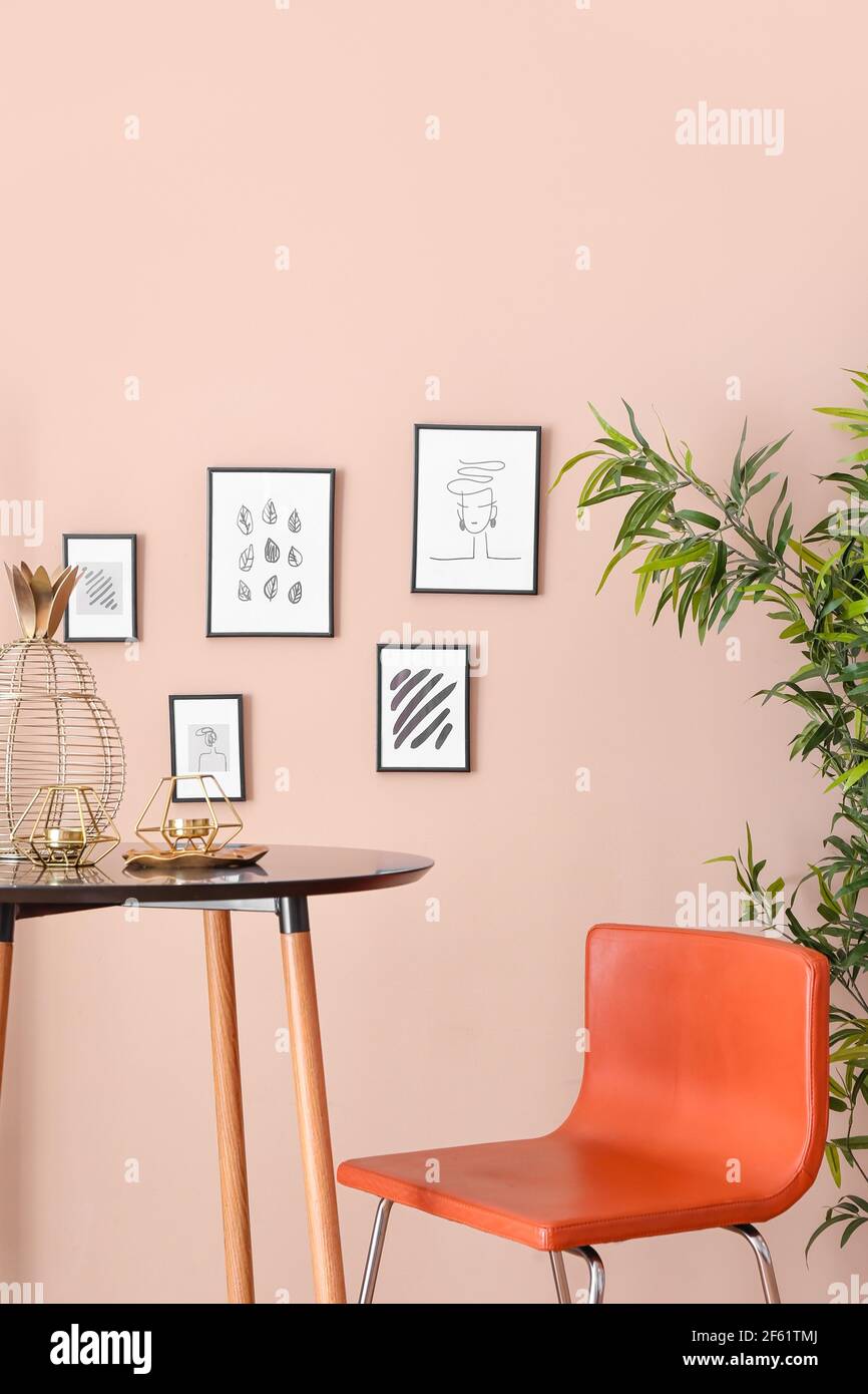 Stylish interior of living room with beautiful pictures Stock Photo - Alamy