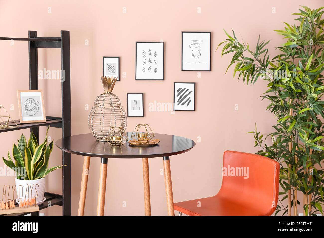 Stylish interior of living room with beautiful pictures Stock Photo - Alamy