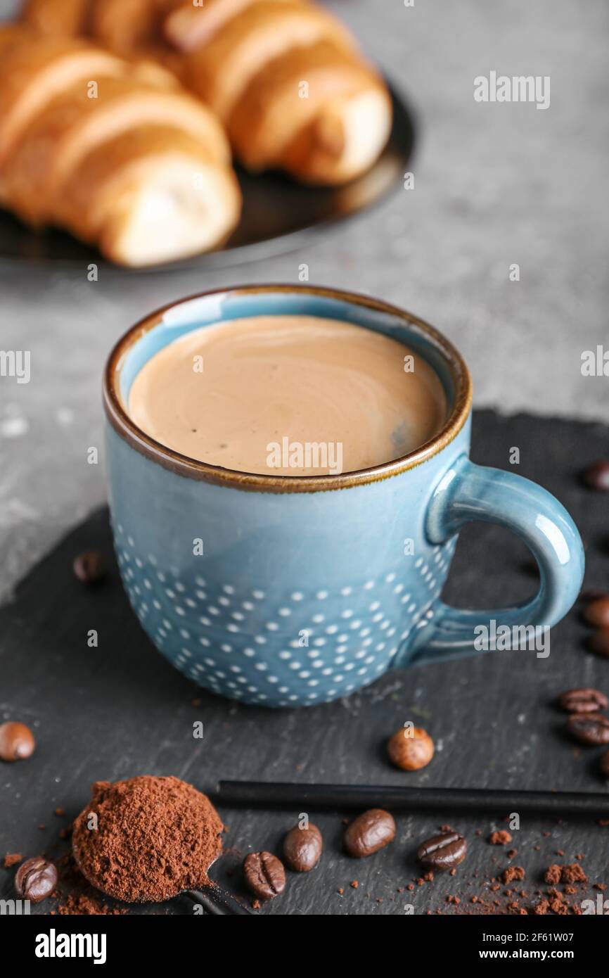 Cup of tasty hot coffee on grunge background Stock Photo - Alamy