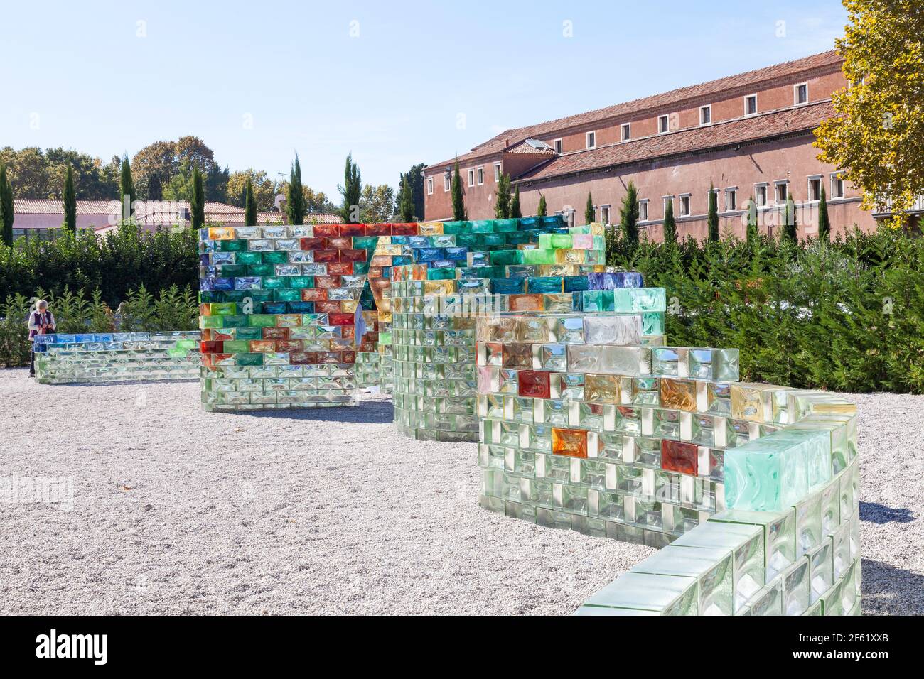 Woman photographing the glass  wall exhibit Qwalala by Pae White in Venice, Italy  on San Giorgio Maggiore Island during the 2017 Art Biennale Stock Photo