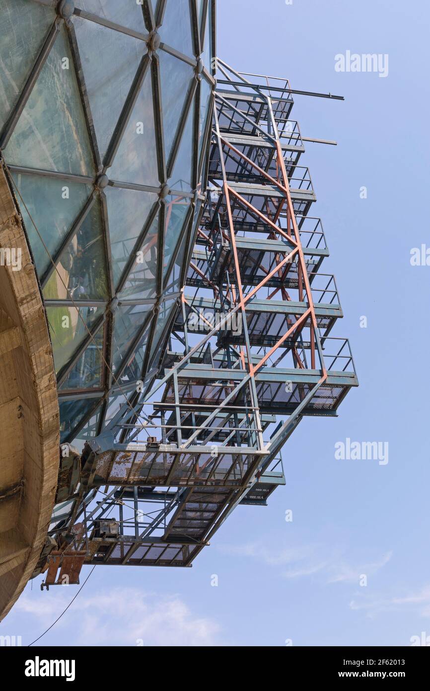 Scaffoldings at Oval Glass Building Structure Construction Site Stock Photo