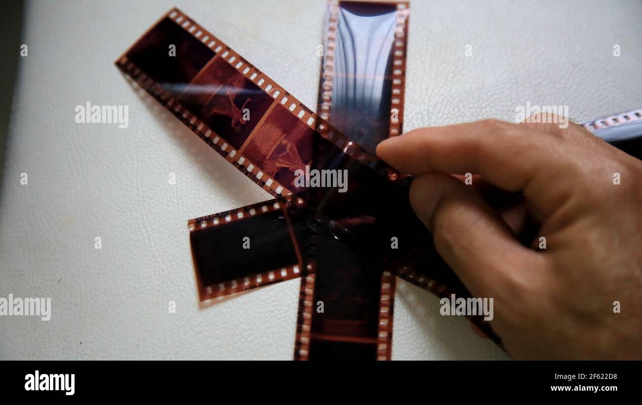 salvador, bahia / brazil - may 14, 2020: negative photography film held by hand. *** Local Caption *** . Stock Photo