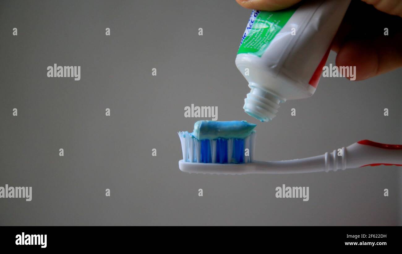salvador, bahia / brazil - may 13, 2020: toothpaste is seen with a ...