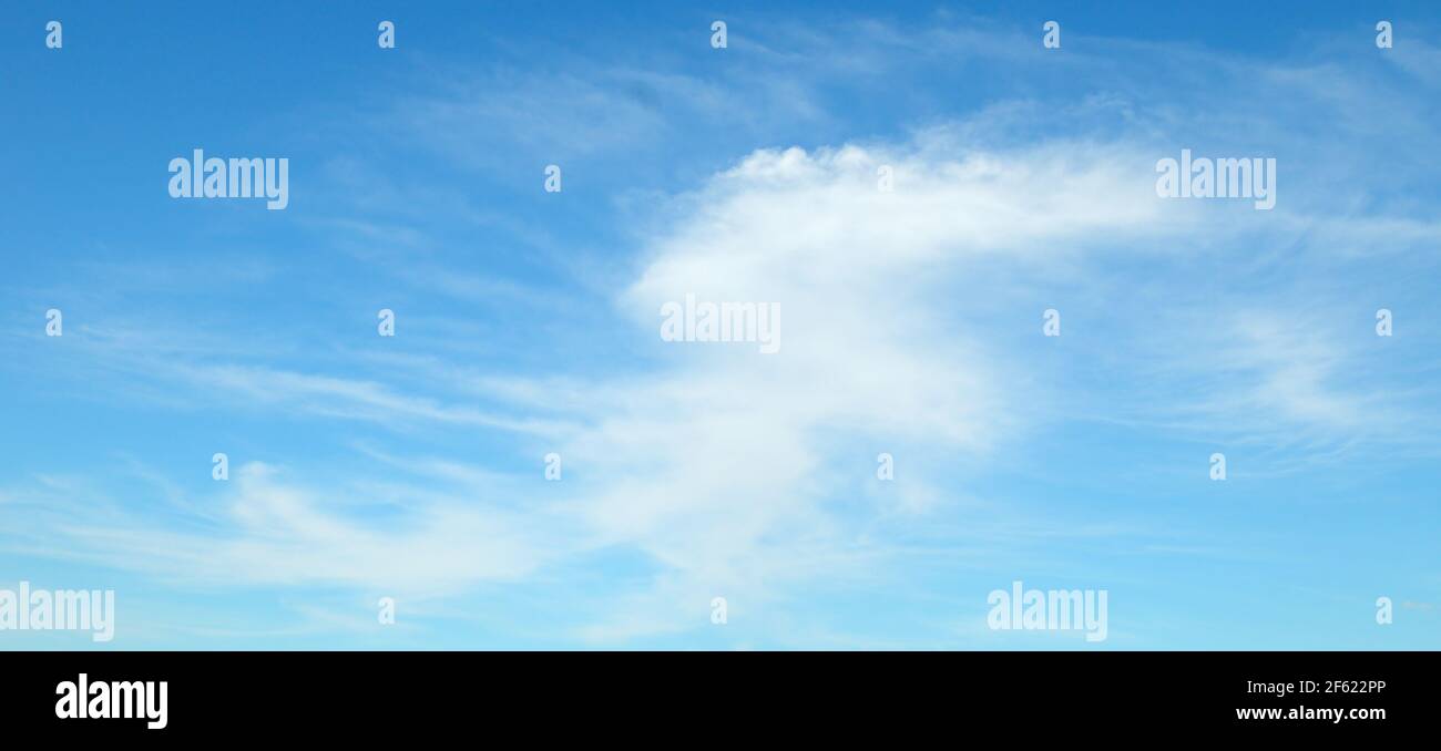 Light cumulus clouds in the blue sky. Wide photo Stock Photo - Alamy