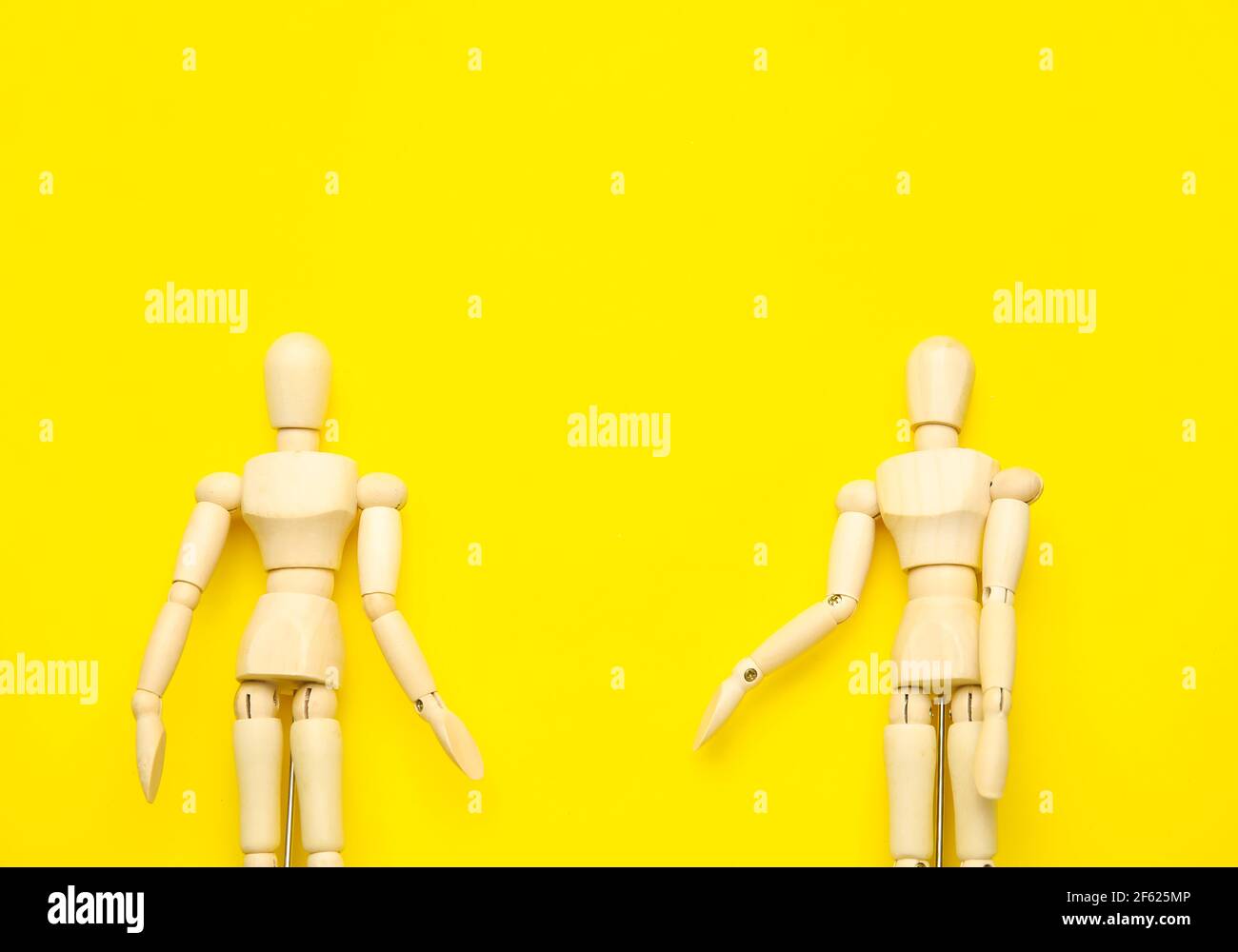 Wooden mannequins on color background Stock Photo - Alamy