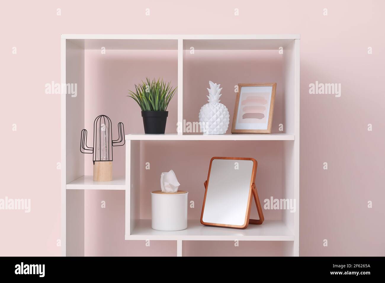 Colorful Wall Rack Stylish decor on rack near color wall Stock Photo - Alamy